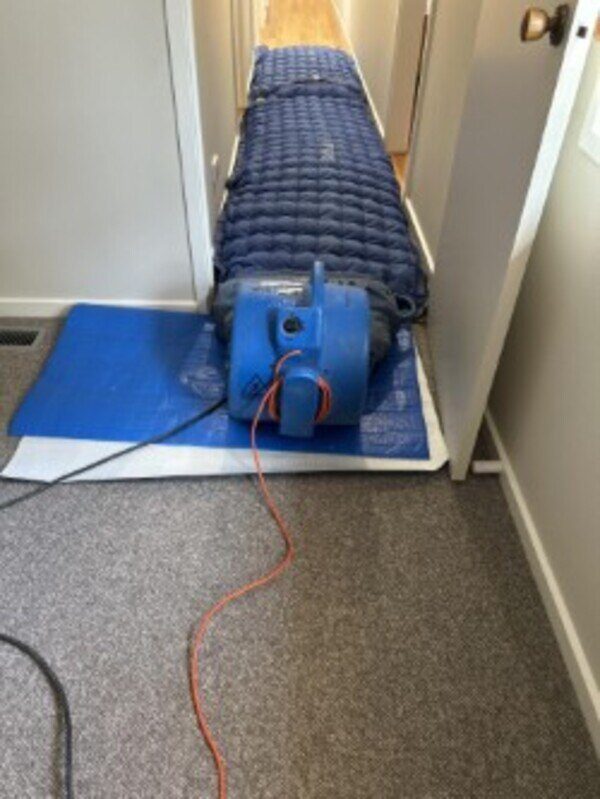 Air movers, restoration heaters and dehumidifers installed to release moisture from timber floorboards 2